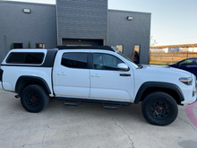 Load image into Gallery viewer, Full passenger side view of Economy Roof Rack from on a white Toyota Tacoma - Cali Raised LED