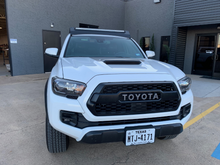Load image into Gallery viewer, Front view of Economy Roof Rack on a white Toyota Tacoma - Cali Raised LED