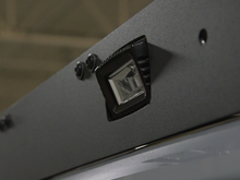 Load image into Gallery viewer, Close up of rear pod light on Premium roof rack - Cali Raised LED
