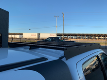 Load image into Gallery viewer, Close up rear view of Economy Roof Rack on a white Toyota Tacoma - Cali Raised LED
