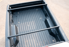 Load image into Gallery viewer, Flat overland bed bars on a Tacoma