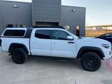 Load image into Gallery viewer, Full passenger side view of Economy Roof Rack from on a white Toyota Tacoma - Cali Raised LED
