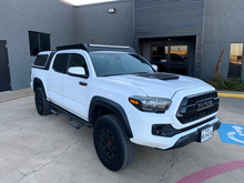 Load image into Gallery viewer, Front passenger view of white Toyota Tacoma with Economy Roof Rack - Cali Raised LED
