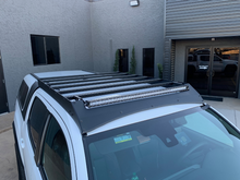 Load image into Gallery viewer, Top view of Economy Roof Rack on a white Toyota Tacoma - Cali Raised LED
