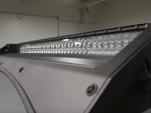 Load image into Gallery viewer, Close up of exposed LED light bar on Premium roof rack - Cali Raised LED
