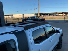 Load image into Gallery viewer, Rear view of Economy Roof Rack on a white Toyota Tacoma - Cali Raised LED
