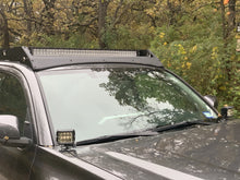 Load image into Gallery viewer, Front view of gray Toyota Tacoma with Premium Roof Rack with exposed light bar- Cali Raised LED
