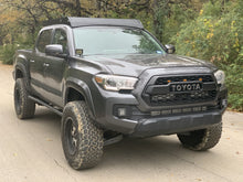 Load image into Gallery viewer, Front passengers side view of gray Toyota Tacoma with Premium roof rack - Cali Raised LED
